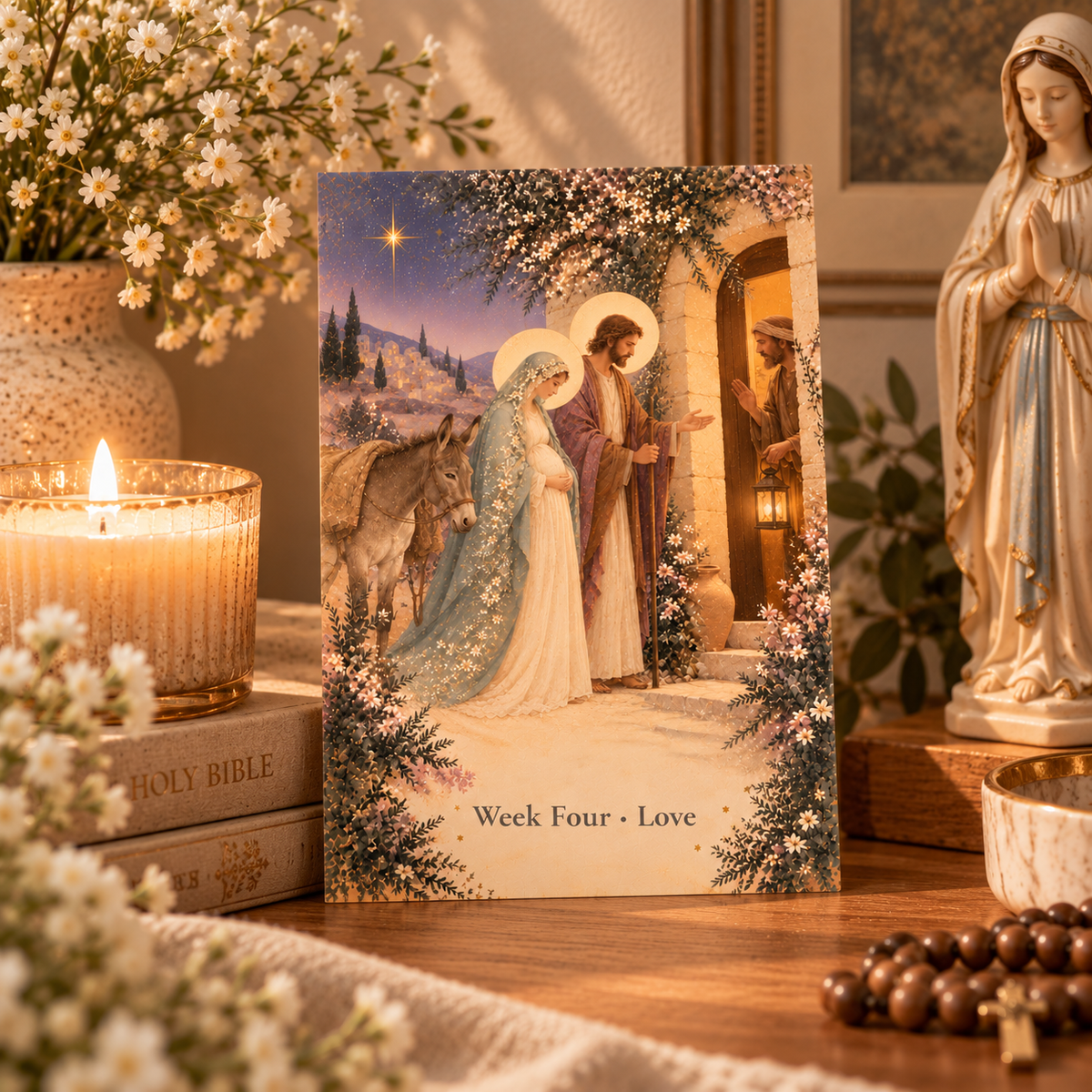 No room at the inn Advent prayer card on a home prayer table with a candle, Holy Bible, wooden rosary and statue of Our Lady